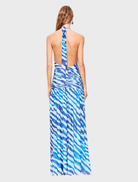 Stylish blue zebra print maxi dress with a halter neckline, ideal for warm weather and outdoor gatherings.