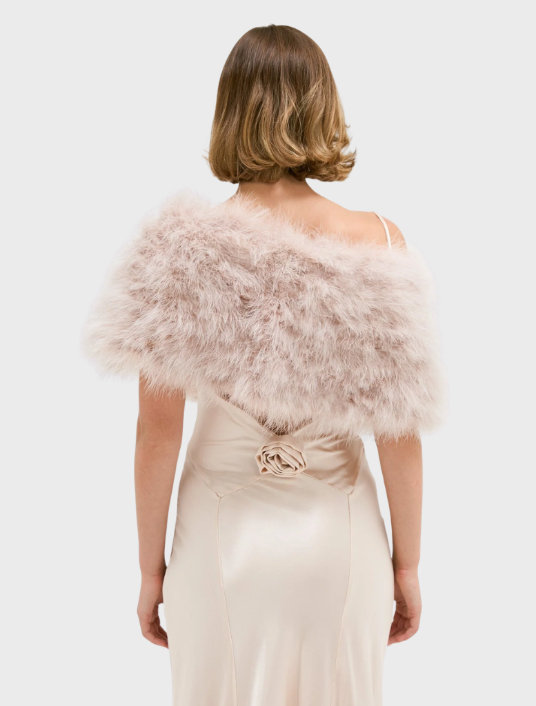 Elegant blush Lottie Wrap crafted from upcycled Marabou Feather, with lightweight design and hand-knit finish.