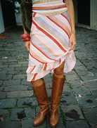 Blush striped midi skirt featuring a frill design, perfect for casual or semi-formal occasions.
