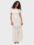 Stylish white maxi dress with a loose fit, suitable for casual wear and summer festivities.