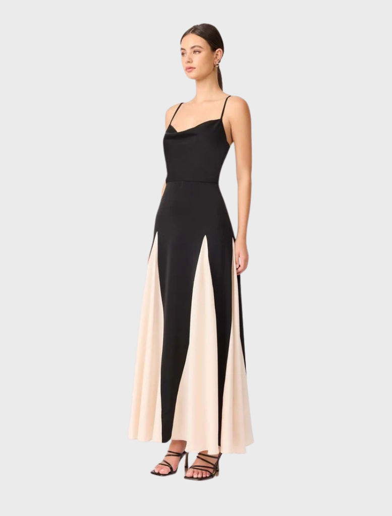 The Brigid Gown in black and cream showcases a cowl neck and a chic side split for a sophisticated look.