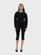 Close-up of a black Bronte knit cardigan, focusing on the knit pattern and open front style.