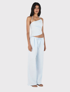 Relaxed mid-low rise straight-leg pants in cornflower blue, featuring an adjustable drawcord and convenient side seam pockets.