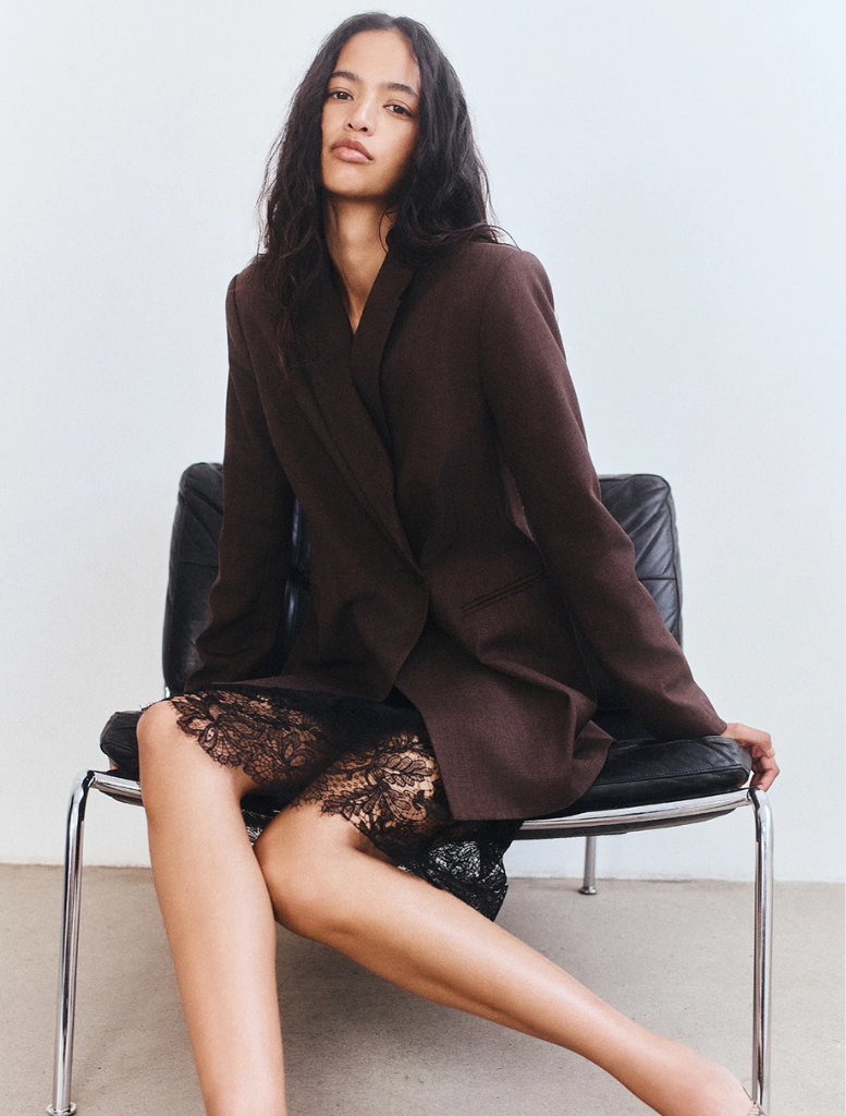 Elegant double-breasted blazer in Ristretto hue, designed for a polished look in business or formal environments.