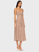 Elegant brown gingham midi dress featuring a classic design with a fitted top and flowing skirt for versatile styling.