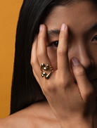 A gold ring embellished with leaf patterns, reflecting a natural and elegant style.