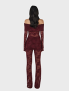 Stylish burgundy lace jumpsuit crafted from fine lace, ideal for a chic look.