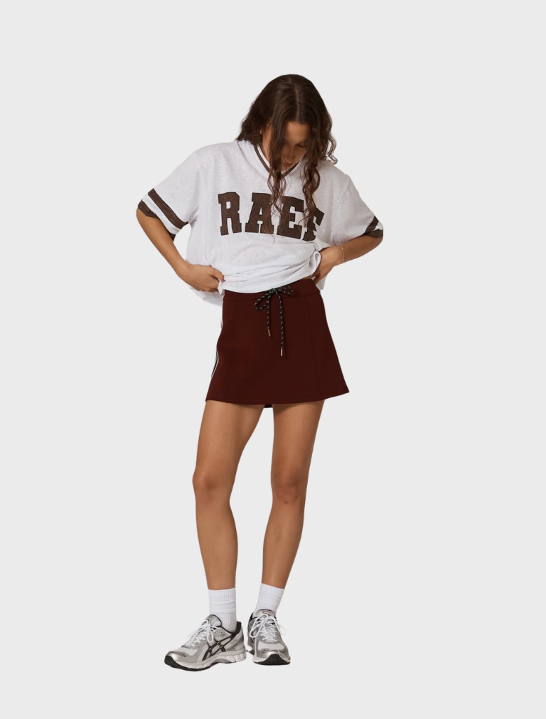 Burgundy Palmer mini skirt shown flat, illustrating its chic design and soft material suitable for various occasions.