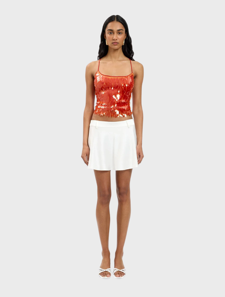 Burnt orange sequin top featuring a backless design, perfect for a glamorous evening look.