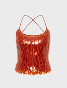 Elegant burnt orange backless top featuring a dazzling sequin finish, perfect for a chic evening look.