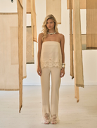 Buttercream Visions Lace Pant showcases a fluid fit, scalloped waistband, and sheer lace hem for an elegant, lightweight design.