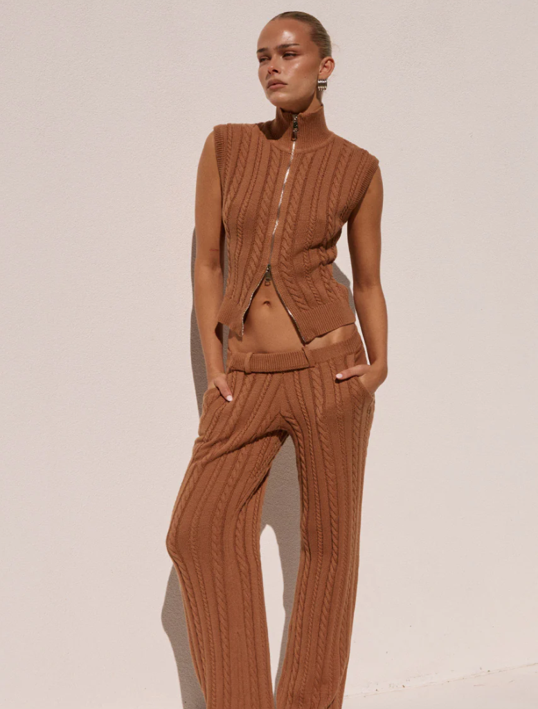 Camila Knit Top in a warm ochre shade, designed for versatility and comfort in casual fashion.