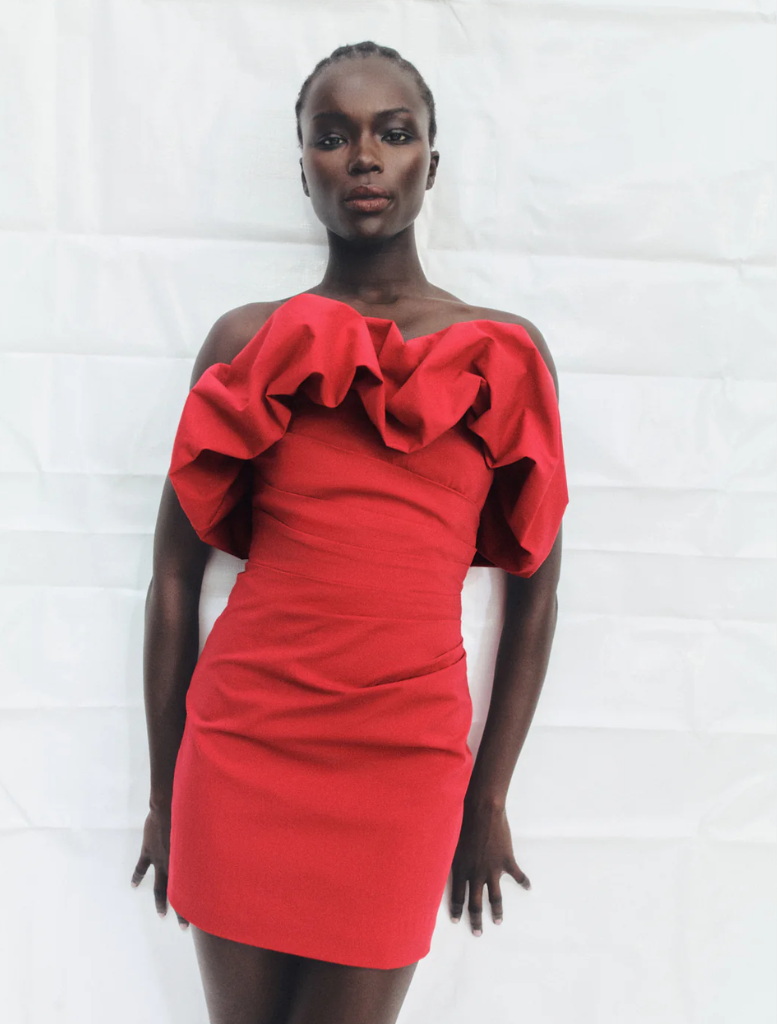 Goji-colored strapless bubble mini dress with a fitted top and voluminous skirt, perfect for a fun, stylish outfit.