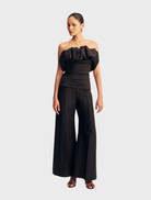 Black strapless bubble top by Campbell, featuring a fitted bodice and a flared hem for a stylish, modern look.