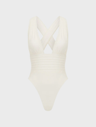 Chic ivory one-piece swimsuit laid flat, highlighting its smooth fabric and minimalist style.
