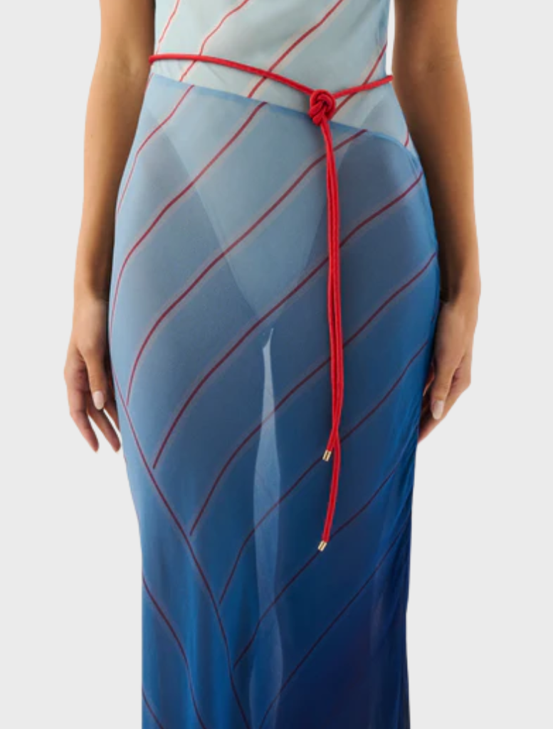 Capri maxi dress featuring a vibrant striped pattern inspired by ocean waves and colors.