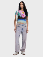 Medium wash denim Cara jeans displayed on a white background, showcasing a classic five-pocket design and straight leg fit.