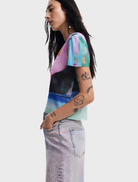 Cara jeans in medium wash denim, presented flat, highlighting their classic style with a straight leg and five-pocket design.