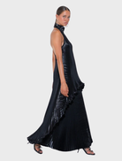 Caribbean Mini dress with a high halter neck and flowing back panel, crafted from signature gloss fabric with pleats.
