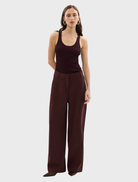 Chic Bordeaux Carmen pants displayed, focusing on their modern design and deep color against a simple background.