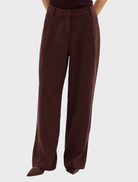  Bordeaux-colored Carmen pants displayed on a white background, showcasing their sleek design and fabric texture.