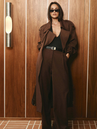 Bordeaux Carmen pants presented on a plain surface, illustrating their sophisticated style and vibrant hue.