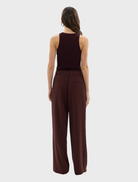 Bordeaux-colored Carmen pants displayed on a white background, showcasing their sleek design and fabric texture.