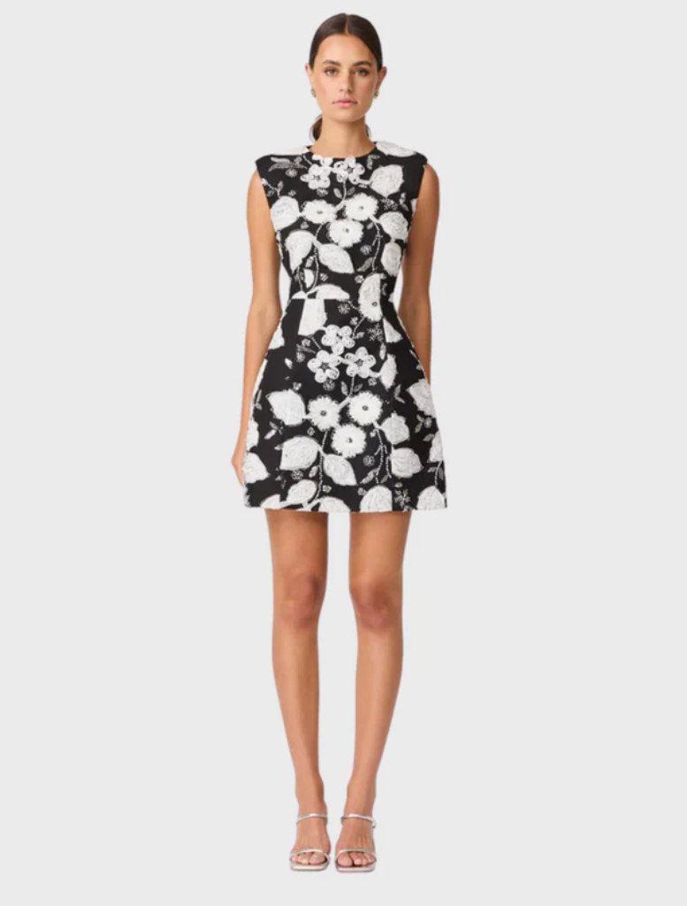Black and white Carol Tulip mini dress featuring a floral design and a flared skirt, perfect for casual or semi-formal occasions.
