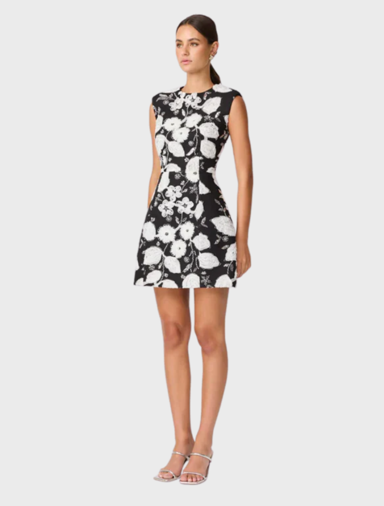 Black and white Carol Tulip mini dress featuring a floral design and a flared skirt, perfect for casual or semi-formal occasions.