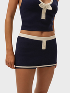 Navy skort by Caroline, combining comfort and style for versatile outfit options.