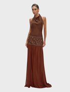 Brown Carrie dress displayed on a mannequin, featuring a fitted bodice and flowing skirt, suitable for casual or formal occasions.
