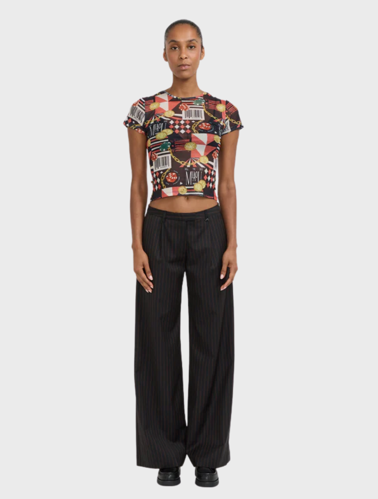 Mini tee designed with a casino motif, displaying colorful playing cards and dice graphics.