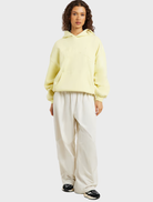 Oversized hoodie in celestial yellow, designed with drop shoulders, long sleeves, and a unique in-house graphic print.