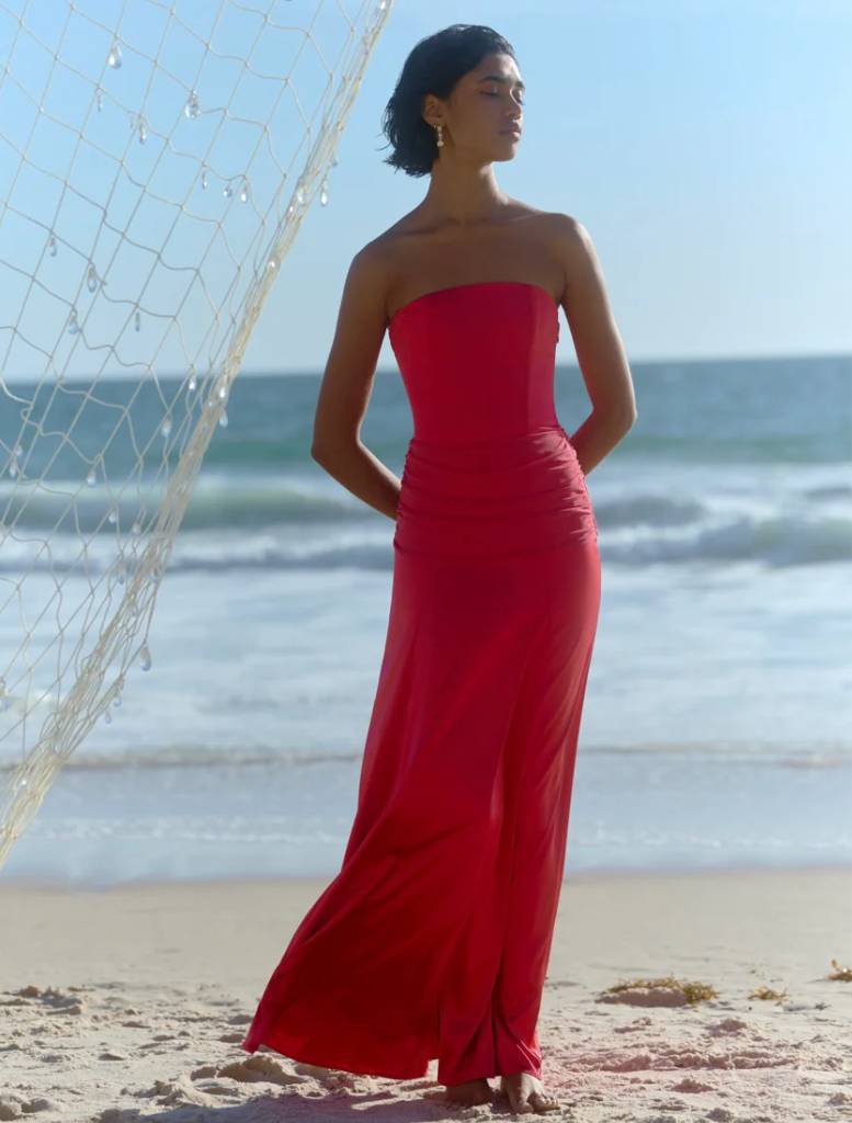 Elegant raspberry Celine Dress showcasing a fitted design, perfect for formal events or special occasions.