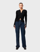 Black Lyon Cardigan showcased, highlighting its long sleeves and open front, perfect for versatile styling.