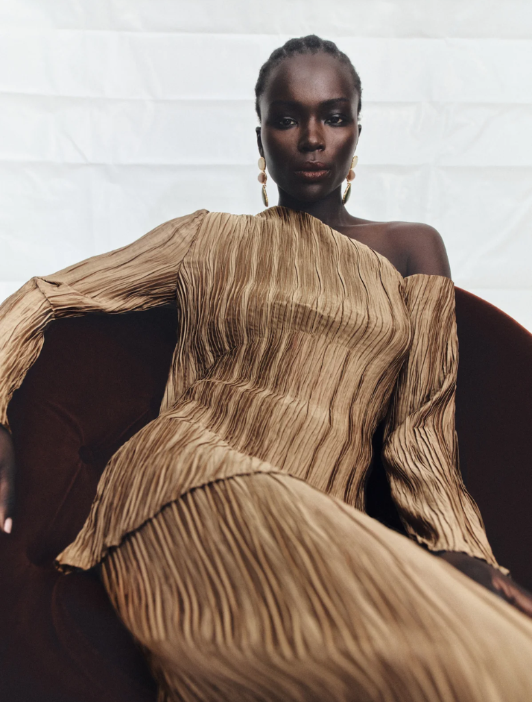 Leda asymmetrical long sleeve top in oak, showcasing a trendy style with an elegant drape and modern appeal.