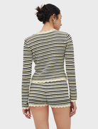 Cream and coffee-colored belted knit shorts, showcasing a stylish and comfortable design for casual wear.