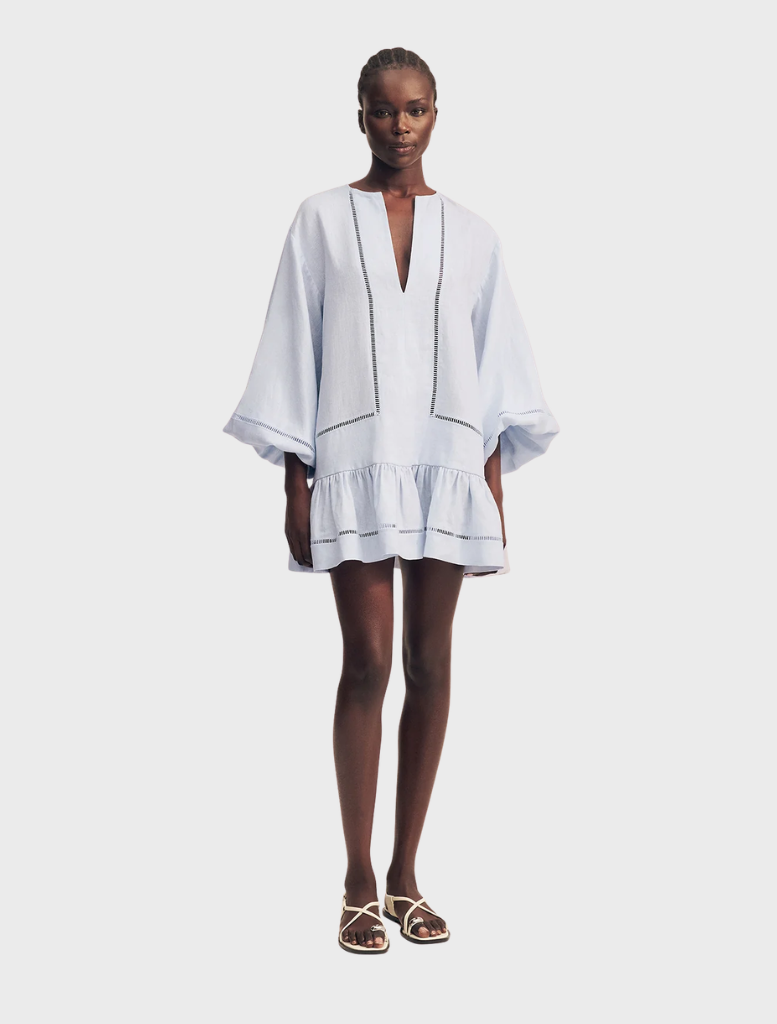 Sky-colored mini dress with balloon sleeves and a playful design, suitable for warm weather and stylish gatherings.