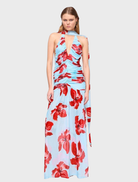 Blue and pink floral halter maxi dress, featuring a flowing silhouette and vibrant floral pattern for a stylish summer look.