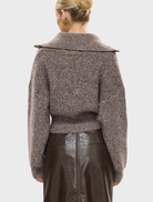Cozy chocolate marle cardigan crafted from ruby wool, featuring an open front and a comfortable, relaxed silhouette.