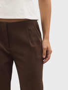 Close-up of the chocolate Pietra Pant, highlighting its fabric texture and elegant silhouette.
