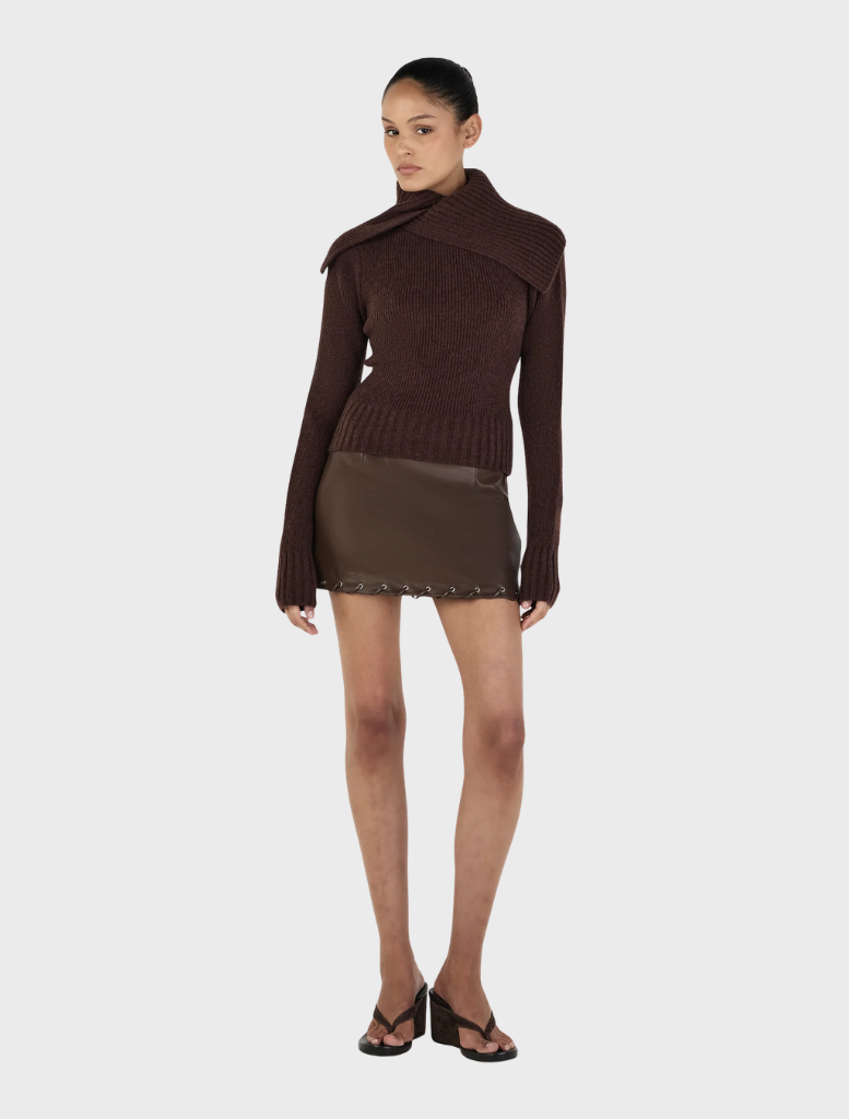 Roxanne turtleneck in chocolate hue, highlighting its sleek silhouette and soft texture, presented on a simple background.
