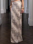 Christina's snake-print skirt features a sleek design, perfect for adding a bold touch to any outfit.