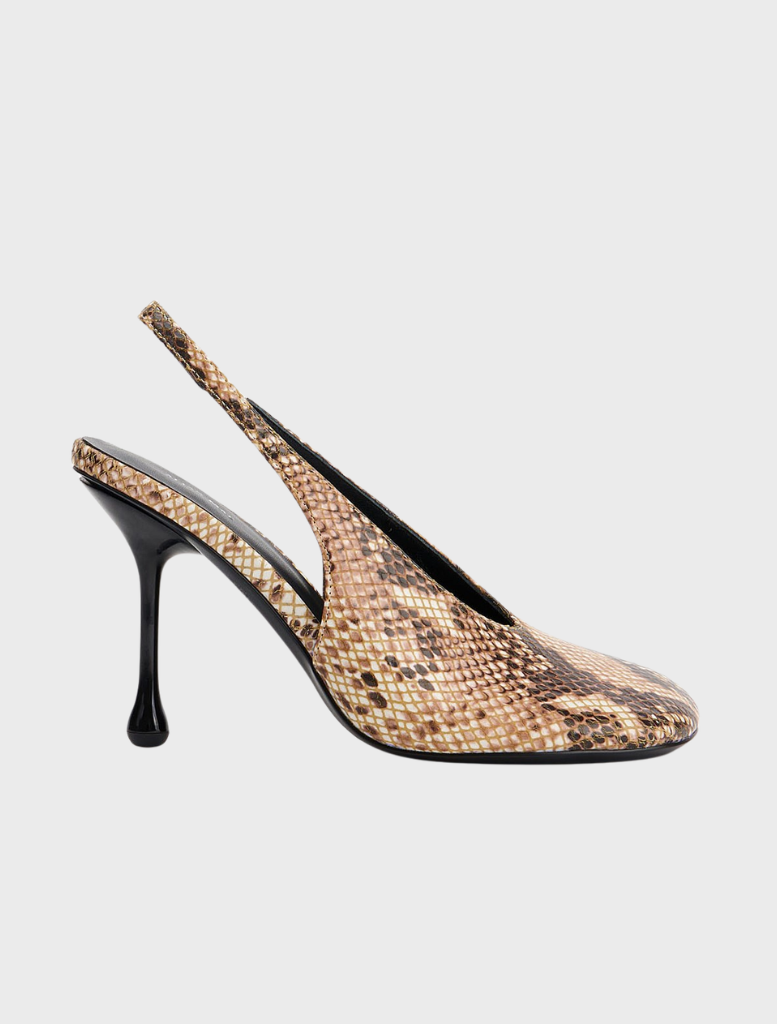 Claire, a Sand Snake, poses confidently in a desert landscape, showcasing her intricate outfit and striking features.