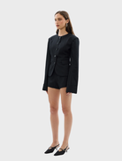 Close-up of the black Alba Jacket, focusing on the stitching and material quality.