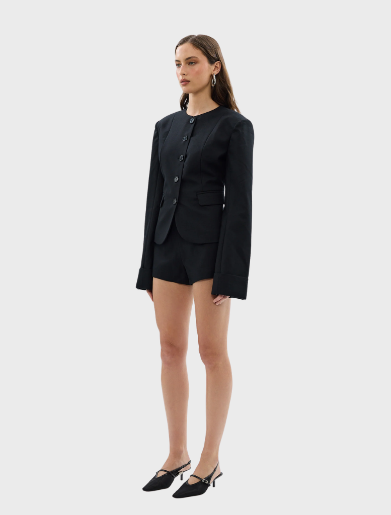 Close-up of the black Alba Jacket, focusing on the stitching and material quality.