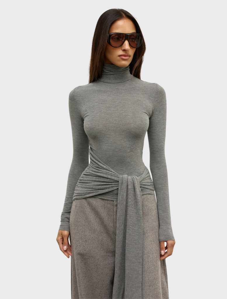 A light grey marle Isley top displayed, illustrating its minimalist design and soft fabric ideal for casual occasions.