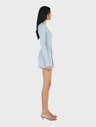Long sleeve top by Quinn in ice blue, offering a soft texture and a stylish silhouette for versatile wardrobe options.