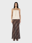 Cream ZOE top displayed, emphasizing its clean lines and soft texture, perfect for versatile styling.