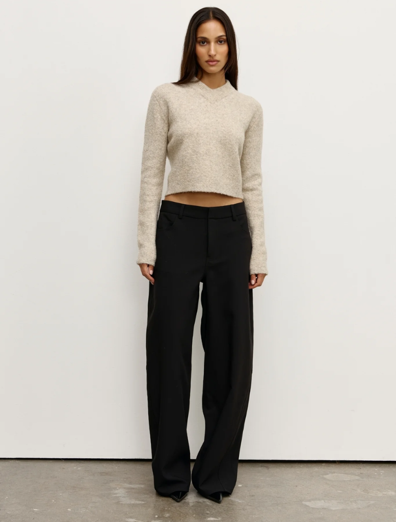 A close-up of the Claudia V Knit in Urchin color, showcasing its textured fabric and unique design.
